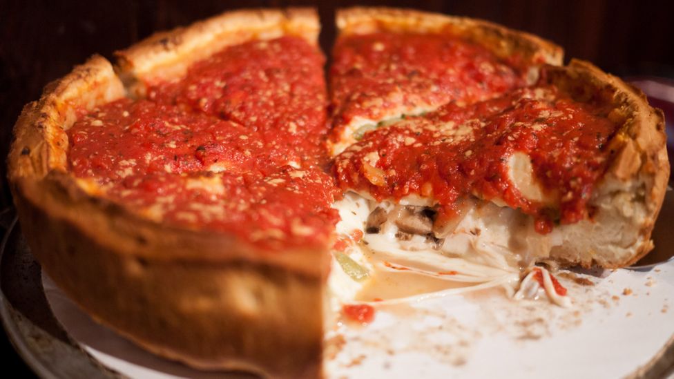While no visit to Chicago is complete without tasting its famed deep dish pizza, the city's culinary scene has much more to offer gourmand business diners. (Credit: Alamy)