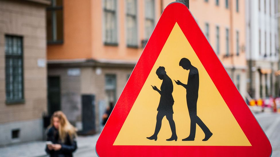 Being glued to your smartphone is a big part of daily working life in this town (Credit: Jonathan Nackstranda/AFP/Getty Images) Being glued to your smartphone is a big part of daily working life in this town (Credit: Jonathan Nackstranda/AFP/Getty Images)