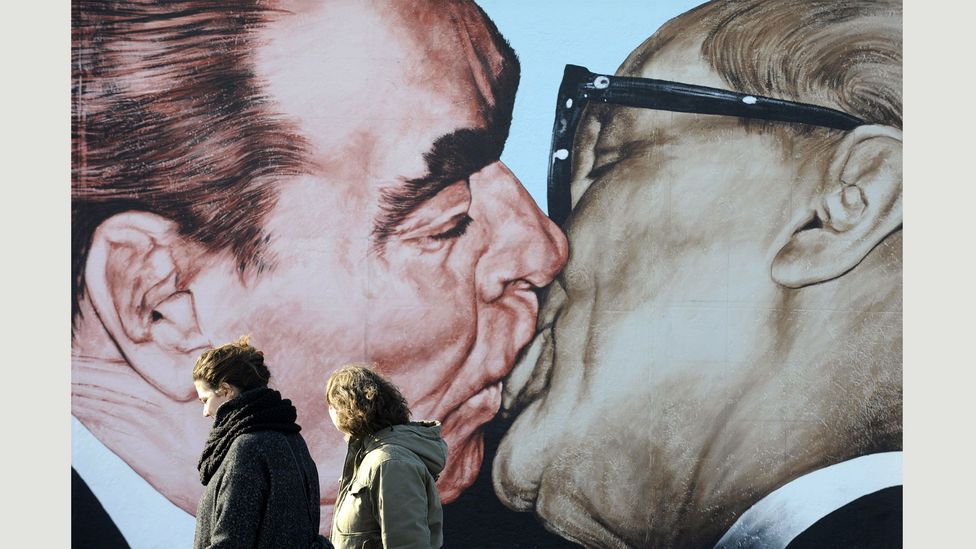 The new mural draws on this painting by Dmitry Vrubel, showing the Soviet leader Leonid Brezhnev and East German leader Erich Honecker (Credit: John Macdougall/AFP/Getty Images)