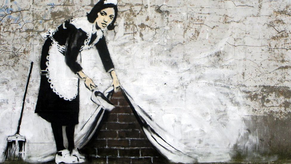 Sweeping it Under the Carpet (2006) by Banksy