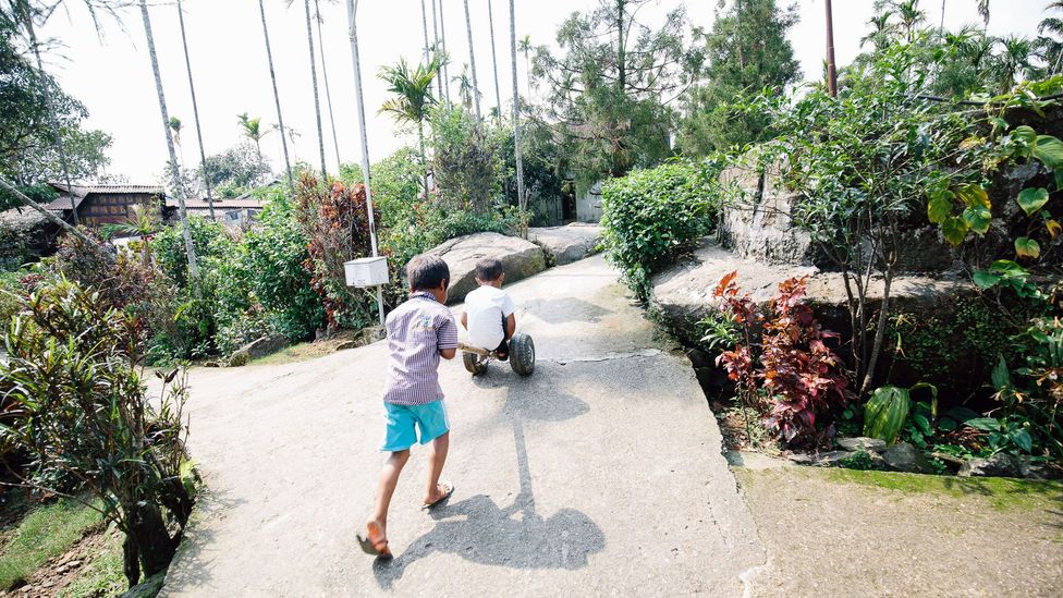 Children play on Mawlynnong’s immaculate streets, which are maintained daily by children and dedicated town gardeners (Credit: Tanveer Badal)