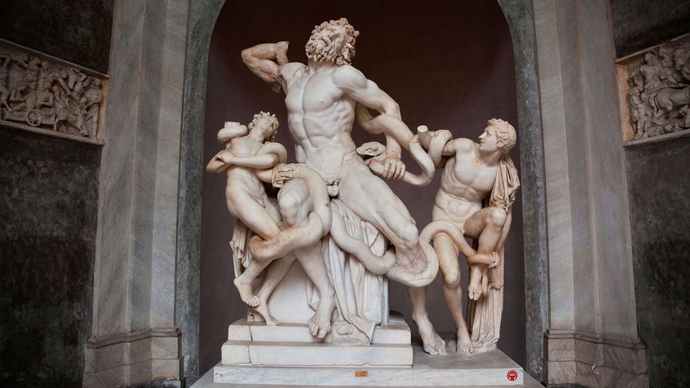 Two sharp-fanged sea serpents writhe around the agonised Trojan priest Laocoon and his innocent sons (Credit: Alamy) Two sharp-fanged sea serpents writhe around the agonised Trojan priest Laocoon and his innocent sons (Credit: Alamy)