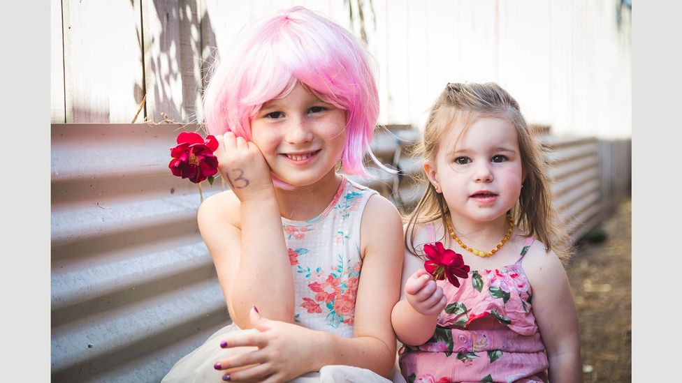 Five-year-old Briella, pictured here with her sister Shayla, took part in a series of portraits of transgender children by photographer Emma Leslie (Credit: Emma Leslie) Five-year-old Briella, pictured here with her sister Shayla, took part in a series of portraits of transgender children by photographer Emma Leslie (Credit: Emma Leslie)