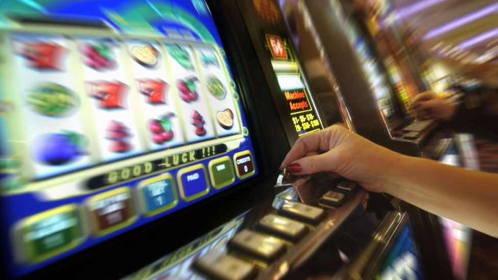 Some machines may be designed to actively entice us to gamble with the very colours they use (Credit: Getty Images)