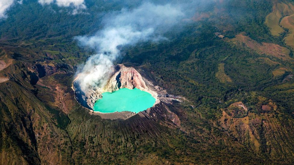 Sulphuric gases combined with dissolved metals makes Kawah Ijen Lake electric blue (Credit: Denis Moskvinov/Alamy)