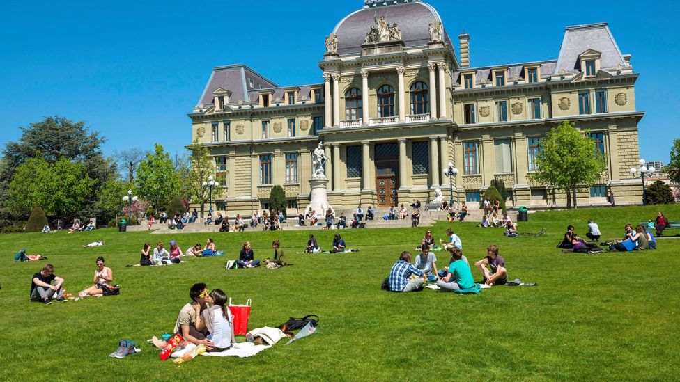 People gather on a lawn in the Swiss university town of Lausanne (Credit: Hemis/Alamy)