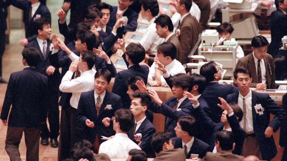 Dealers work on the floor of the Tokyo Stock Exchange in March 1992 (Credit: Getty Images) Dealers work on the floor of the Tokyo Stock Exchange in March 1992 (Credit: Getty Images)
