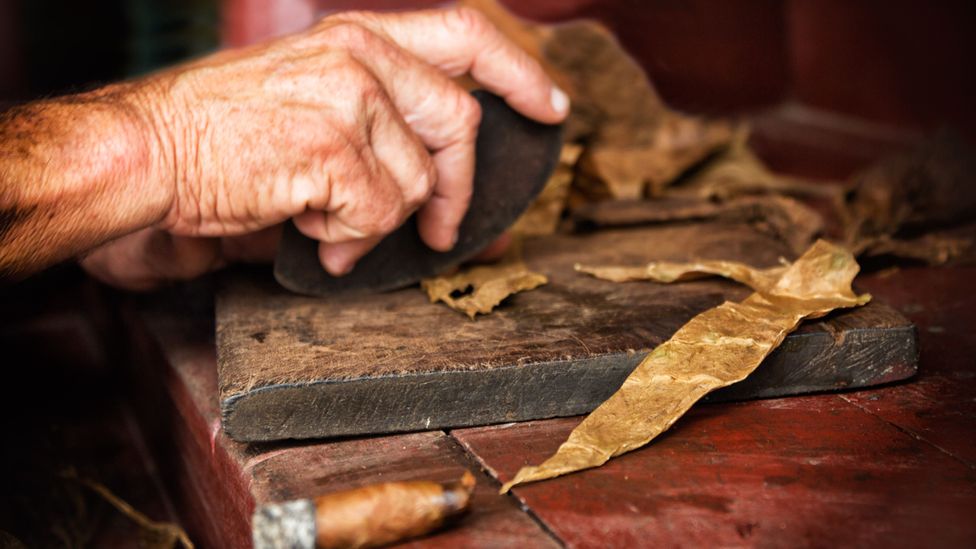 Hand-rolled cigars are being kept aglow by a sizeable pool of avid collectors (Credit: Getty Images) Hand-rolled cigars are being kept aglow by a sizeable pool of avid collectors (Credit: Getty Images)