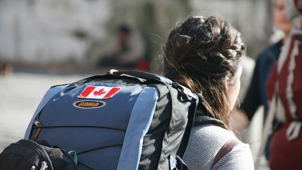 Canadian English is so similar to US English that Canadians traveling abroad often affix their flag to their backpacks to identify themselves (Credit: Alamy)