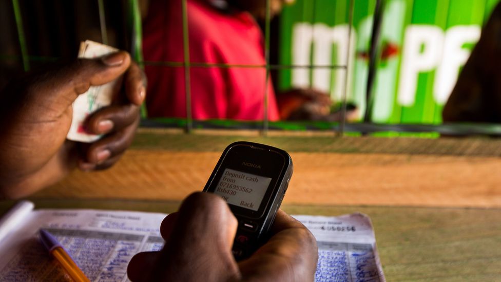 An employee in an M-Pesa store in Nairobi, Kenya where mobile payments are now used for millions of transactions (Credit: Trevor Snapp/Bloomberg/Getty Images) An employee in an M-Pesa store in Nairobi, Kenya where mobile payments are now used for millions of transactions (Credit: Trevor Snapp/Bloomberg/Getty Images)