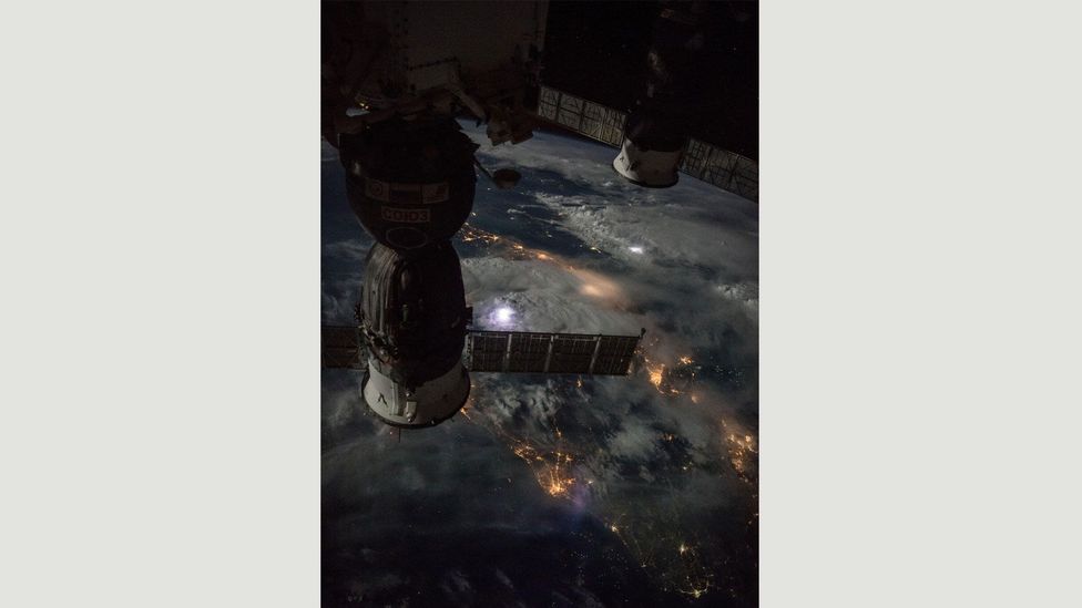 The International Space Station flies approximately 250 miles (402 km) over thunderstorms during a nighttime pass on 18 September 2016 (Credit: International Space Station)