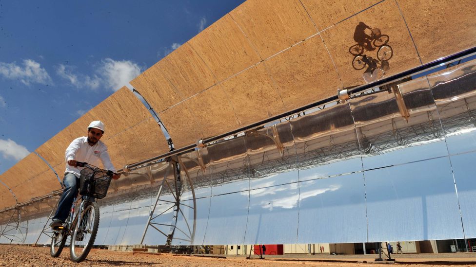 Hundreds of curved mirrors, each as big as a bus, are ranked in rows covering 1,400,000 square metres of desert, an area the size of 200 football fields (Credit: Getty Images) Hundreds of curved mirrors, each as big as a bus, are ranked in rows covering 1,400,000 square metres of desert, an area the size of 200 football fields (Credit: Getty Images)