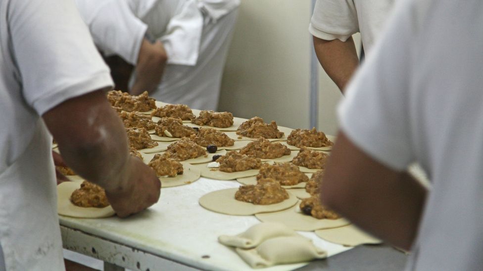 The pastry is filled and then rolled into parcels (Credit: Ian Lloyd Neubauer)