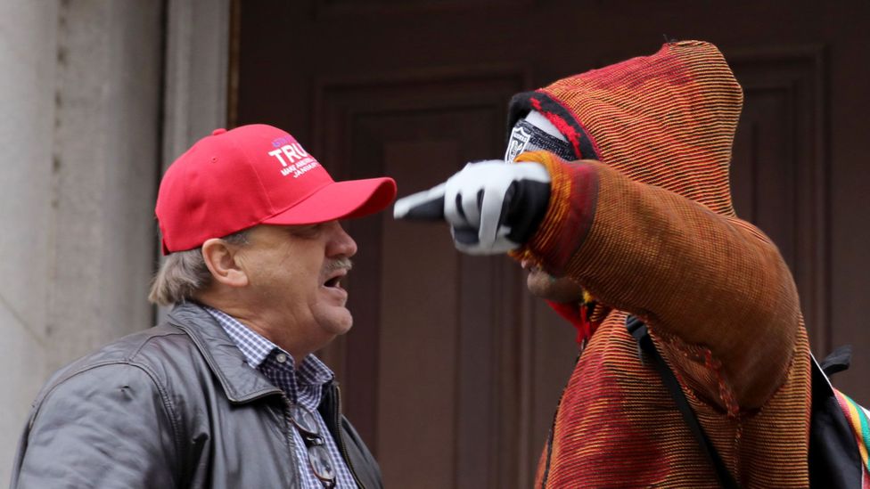 A Donald Trump supporter and a protestor argue during the Women's March On Washington on 21 January 2017 (Credit: Tasos Katopodis/Getty Images) A Donald Trump supporter and a protestor argue during the Women's March On Washington on 21 January 2017 (Credit: Tasos Katopodis/Getty Images)