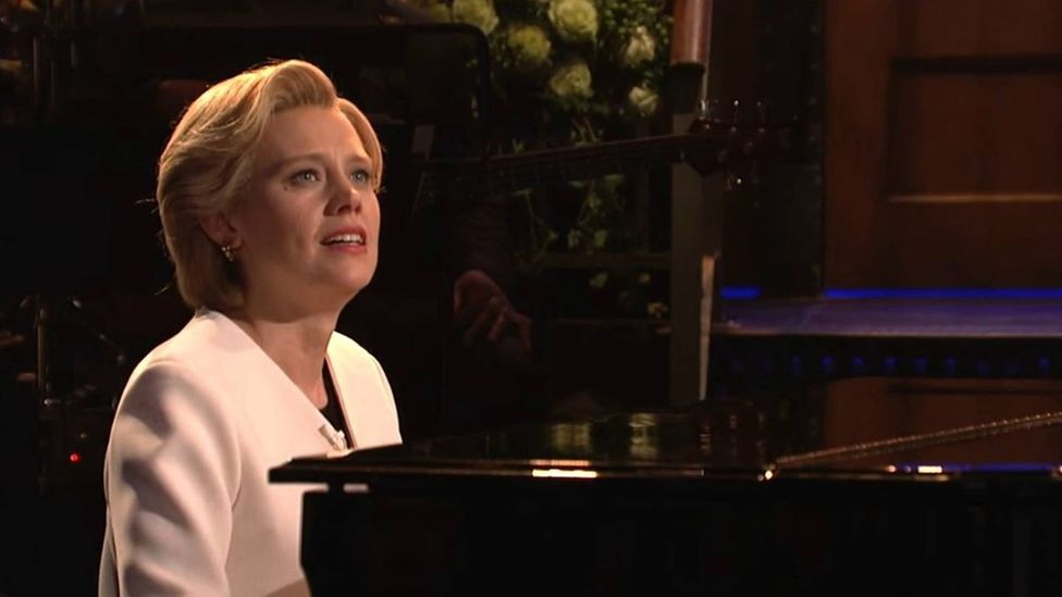 After Trump’s election, some comedians turned somber, such as when Kate McKinnon, as Hillary Clinton, sang Hallelujah on Saturday Night Live (Credit: NBC)
