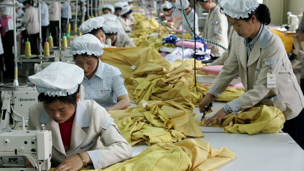 North Korean women work with dexterity at a South Korean textile company (Credit: Getty Images) North Korean women work with dexterity at a South Korean textile company (Credit: Getty Images)