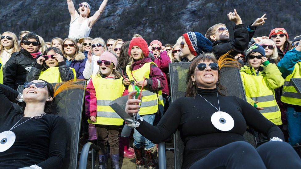 People cheer during an inauguration of the Sun mirrors (Credit: Krister Soerboe/AFP/Getty Images)