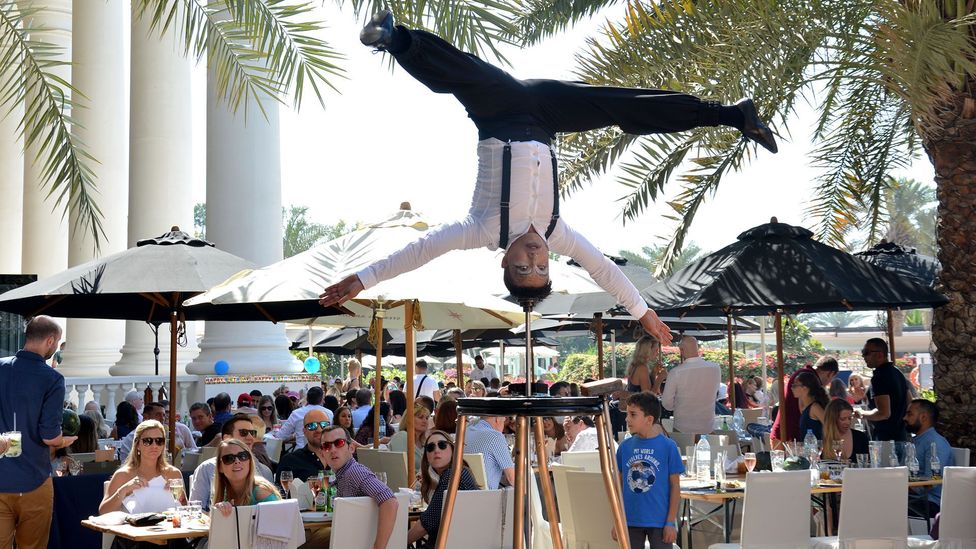Some brunches offer live entertainment such as acrobats – for a price (Credit: Nomee Gulfam) Some brunches offer live entertainment such as acrobats – for a price (Credit: Nomee Gulfam)