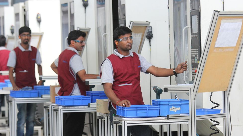 India is trying to future-proof job loss by acquainting students and workers to changing tech - workers are seen here in a Bangalore automation factory (Credit: Alamy Stock Photo)