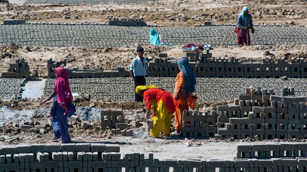 Repetitive, labourious tasks, like the brick-laying seen here in Uttar Pradesh, are especially at risk of being replaced with smart machines (Credit: Alamy Stock Photo)