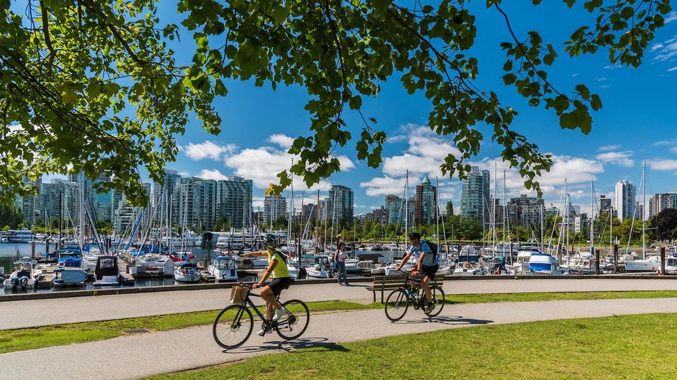 Cities like Vancouver, whose design and building policies accommodate nearby natural greenery, are often surveyed as popular places to live. (Credit: Alamy Stock Photo)