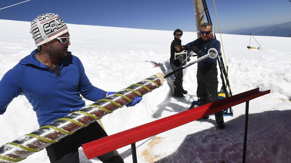 Scientists with an ice core in Antarctica (Credit: Getty Images)