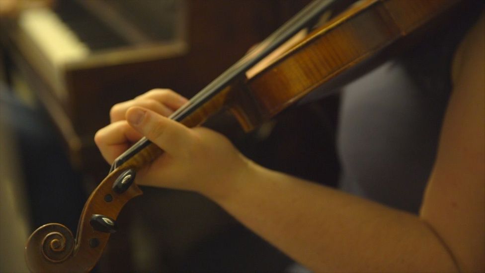 Close-up of a fiddle player in Cape Breton, Nova Scotia (Credit: Eliana Alvarez Martinez) Close-up of a fiddle player in Cape Breton, Nova Scotia (Credit: Eliana Alvarez Martinez)