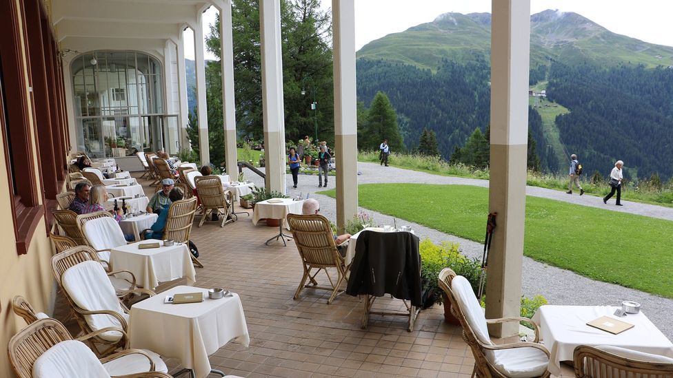 Switzerland’s historical Schatzalp Hotel is situated in a high Alpine valley above rolling pastures (Credit: Mike MacEacheran)