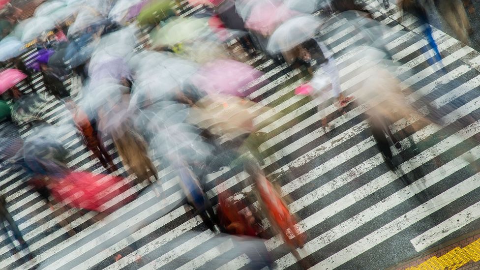 Japanese pedestrians in rain (Credit: Alamy)