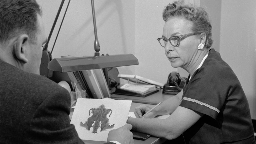 A psychologist discusses a patient's interpretation of an inkblot, a psychoanalytical method known as a Rorschach test (Credit: Getty Images)