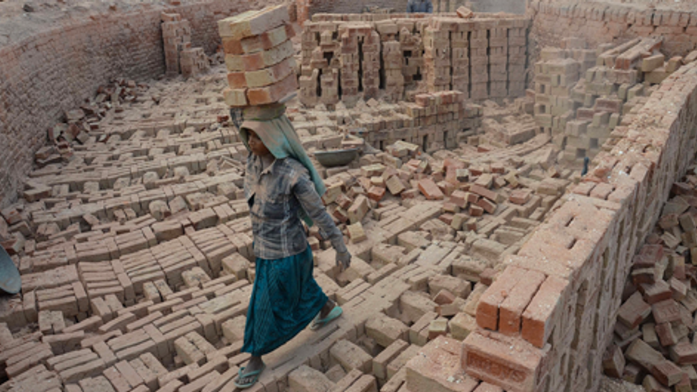 An Indian woman works at a brick kiln on the International Women's Day in Dimapur, India north eastern state of Nagaland (Credit: Getty Images)