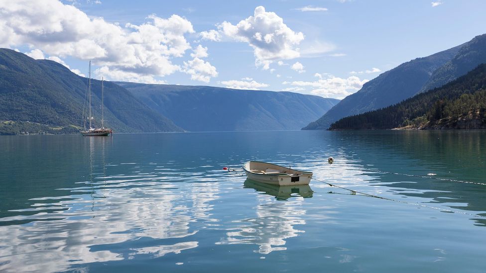 The calm waters of a Norwegian fjord are very different to the rough seas of the open Atlantic (Credit: Alamy) The calm waters of a Norwegian fjord are very different to the rough seas of the open Atlantic (Credit: Alamy)