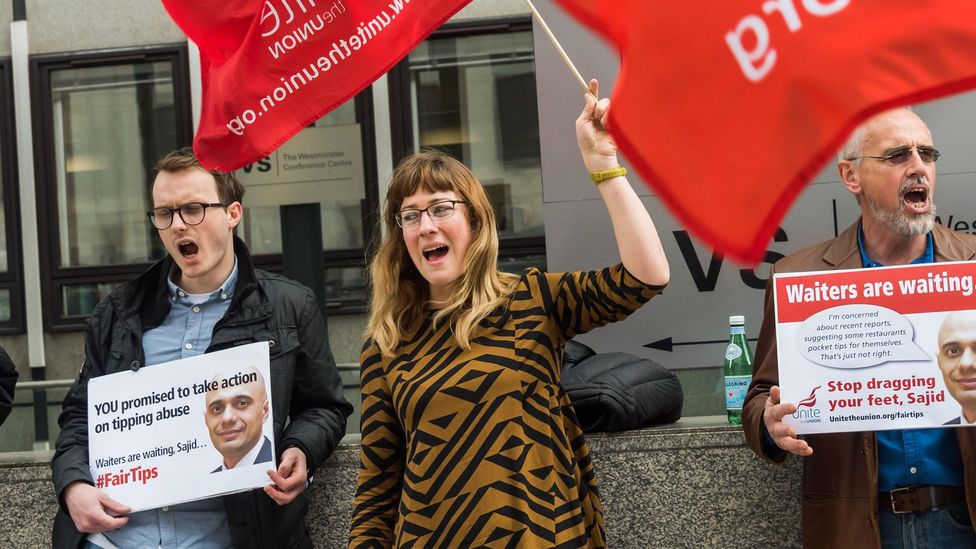 Hotel workers in London last year protesting for mandatory rules on tipping in hotels and restaurants so that the staff get 100% of all tips (Credit: Alamy Live News) Hotel workers in London last year protesting for mandatory rules on tipping in hotels and restaurants so that the staff get 100% of all tips (Credit: Alamy Live News)
