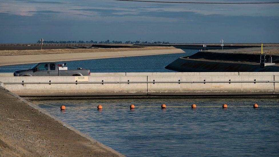 Since its construction, this bridge over a canal in San Joaquin Valley has sunk about 1 metre (4ft) as the land has subsided (Credit: Alamy)