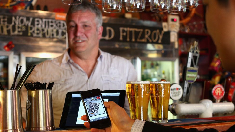Using a smartphone and a QR code scanning application customers can pay at the bar. The Old Fitzroy was the first Australian pub to accept Bitcoin payment (Credit: Getty Images) Using a smartphone and a QR code scanning application customers can pay at the bar. The Old Fitzroy was the first Australian pub to accept Bitcoin payment (Credit: Getty Images)