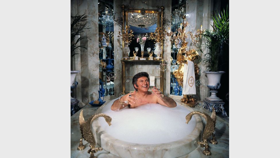 From the 1960s, bathrooms became more of a place to display status - Liberace is pictured here bathing in his own $55,000 marble bathtub (Credit: Getty Images) From the 1960s, bathrooms became more of a place to display status - Liberace is pictured here bathing in his own $55,000 marble bathtub (Credit: Getty Images)