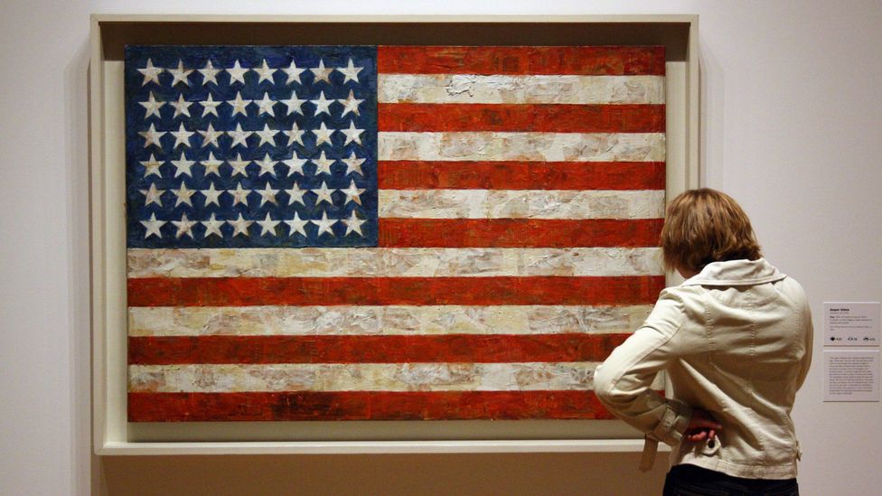 Jasper Johns' Flag posits questions similar to Magritte's work – is this a flag even though it's made up of painted bits of newspaper rather than cloth? (Credit: Alamy)