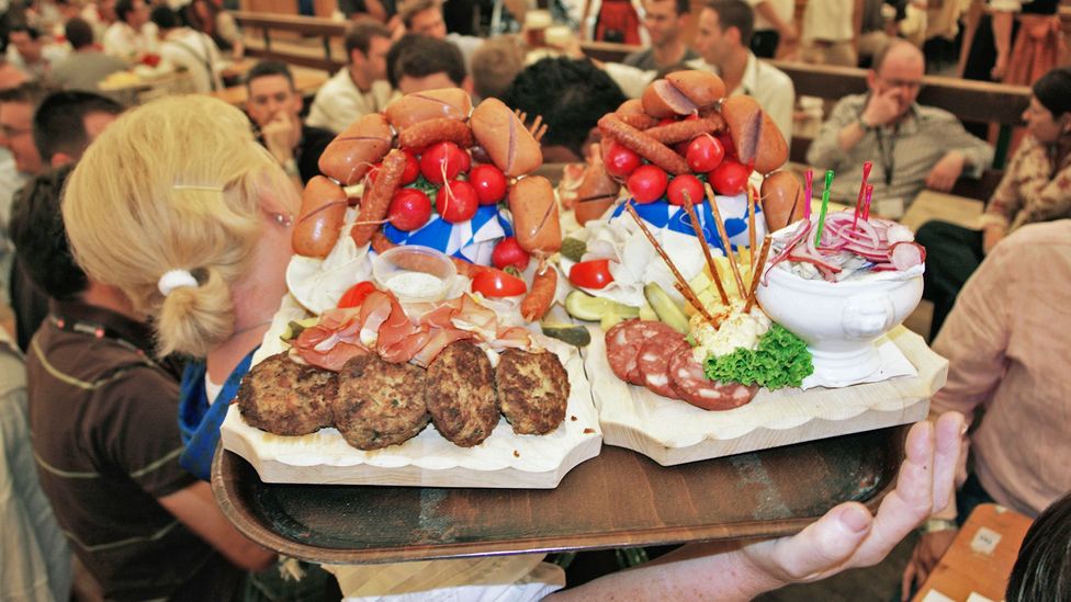 Sausages are always on the menu at German beer halls, or Biergartens (Credit: Pat Behnke/Alamy)