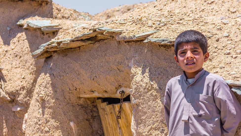 Of the roughly 200 houses in Makhunik, 70 or 80 stand only 1.5 to 2m tall (Credit Mohammad M. Rashed) Of the roughly 200 houses in Makhunik, 70 or 80 stand only 1.5 to 2m tall (Credit Mohammad M. Rashed)