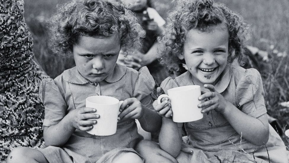 Happy and sad twins (Credit: Alamy)