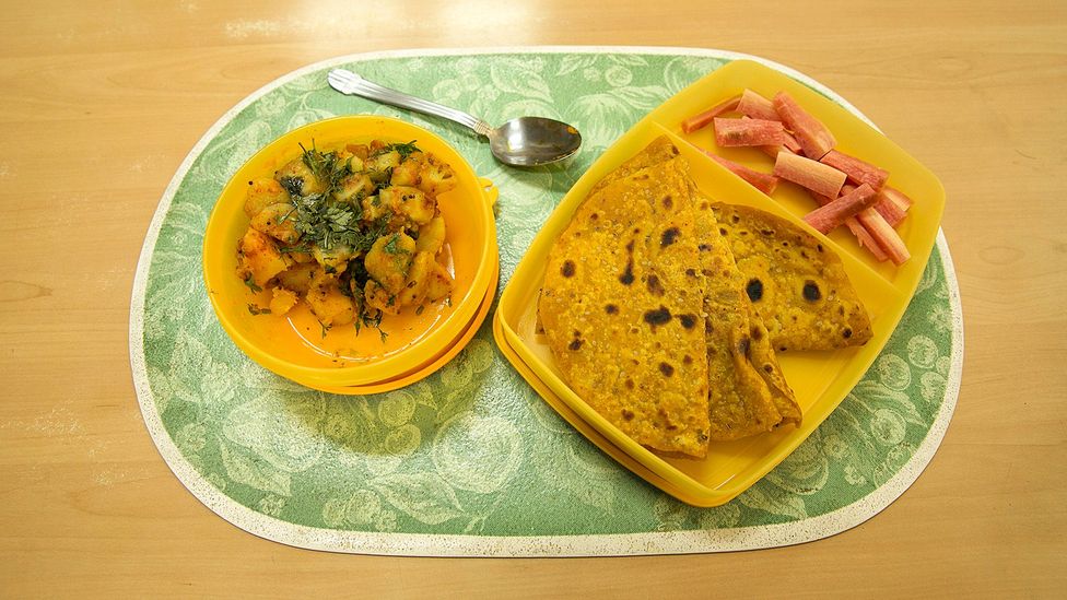 Carrot salad, masala roti and suka bhaji potatoes (Credit: Mayank Soni) Carrot salad, masala roti and suka bhaji potatoes (Credit: Mayank Soni)
