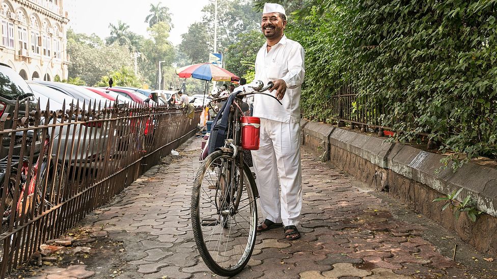 A dabbawala delivers carrot salad, masala roti and suka bhaji potatoes (Credit: Mayank Soni) A dabbawala delivers carrot salad, masala roti and suka bhaji potatoes (Credit: Mayank Soni)