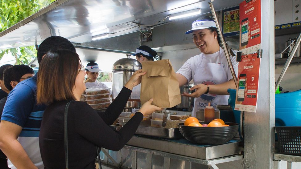 Squid sisig, seafood paella and sweet and sour pork, from Jollijeep Lirios (Credit: Jericho San Miguel) Squid sisig, seafood paella and sweet and sour pork, from Jollijeep Lirios (Credit: Jericho San Miguel)