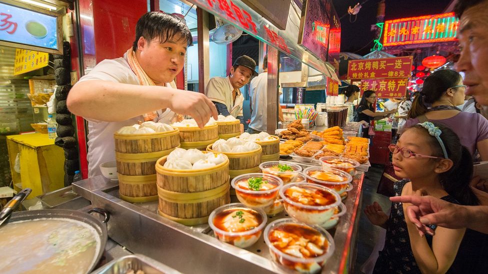 Enjoying old-fashioned food can be an easy way to make local friends (Credit: Edwin Remsberg/Getty Images) Enjoying old-fashioned food can be an easy way to make local friends (Credit: Edwin Remsberg/Getty Images)