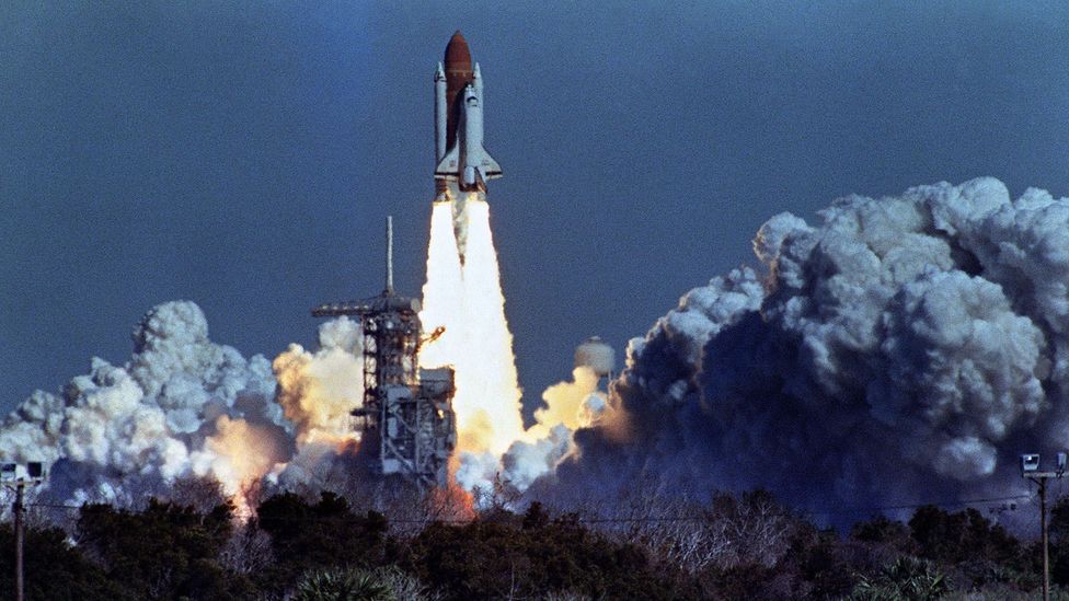 US space shuttle Challenger lifts off 28 January 1986 from a launch pad at Kennedy Space Center, 72 seconds before its explosion killing it crew of seven. (Credit: Getty Images)