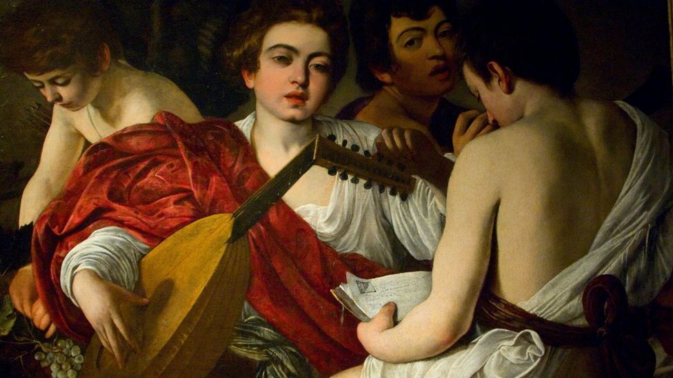 Baroque painters used cochineal red in works, such as The Musicians (1595) by Caravaggio (Credit: Alamy)