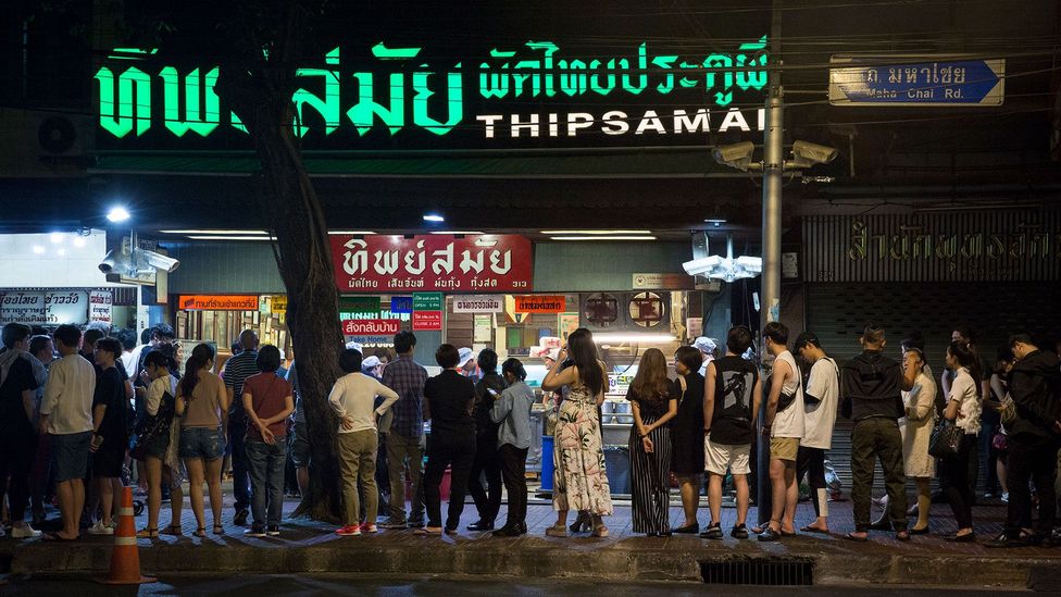 People queue at Thipsamai Pad Thai well before the restaurant opens (Credit: Alisa Suwanrumpha)