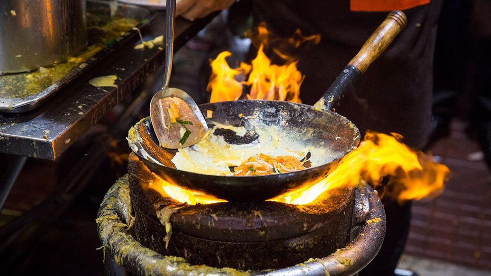 Thipsamai’s ‘original’ pad Thai must be cooked on a searing hot charcoal stove, fired with wood from mangrove trees (Credit: Alisa Suwanrumpha)
