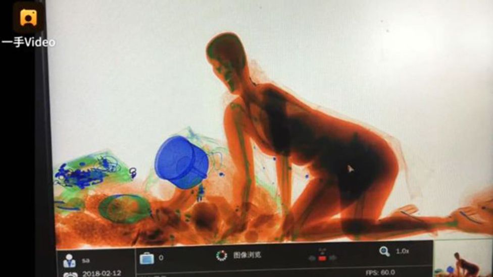 Eerie X-ray images show a woman who climbed into a security scanner in China (Credit: Pear Video)