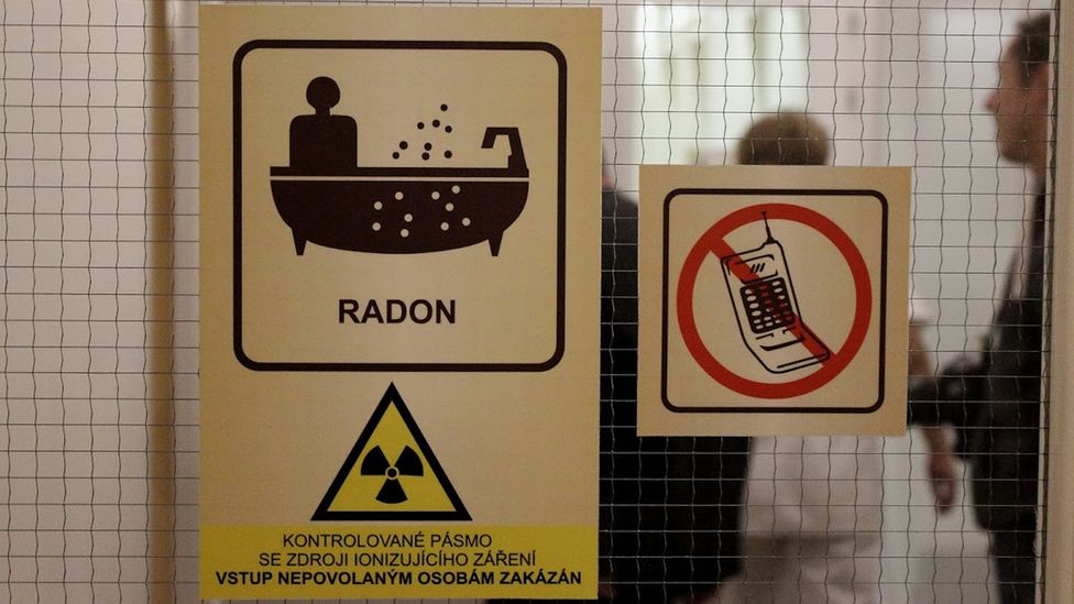 Stickers adorn entrance to an area where radon water therapy is carried out, warning of radioactive material (Credit: Matthew Vickery) Stickers adorn entrance to an area where radon water therapy is carried out, warning of radioactive material (Credit: Matthew Vickery)
